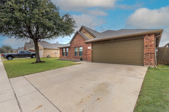 view of front of home with a front lawn and a garage