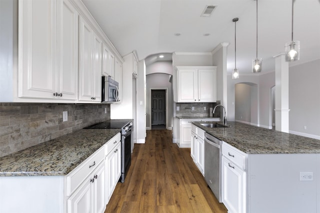 kitchen featuring sink, hanging light fixtures, dark hardwood / wood-style flooring, white cabinets, and appliances with stainless steel finishes