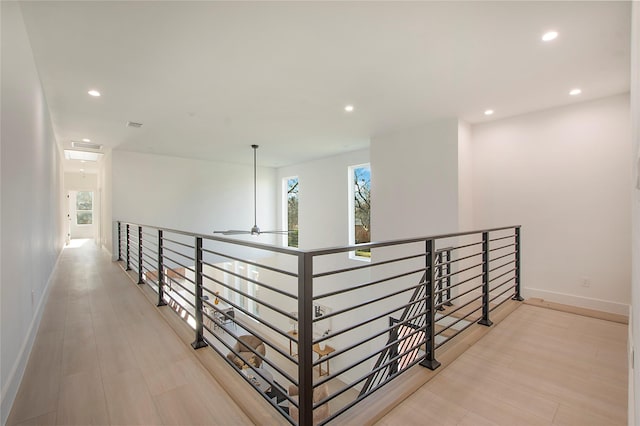 hall with light hardwood / wood-style floors