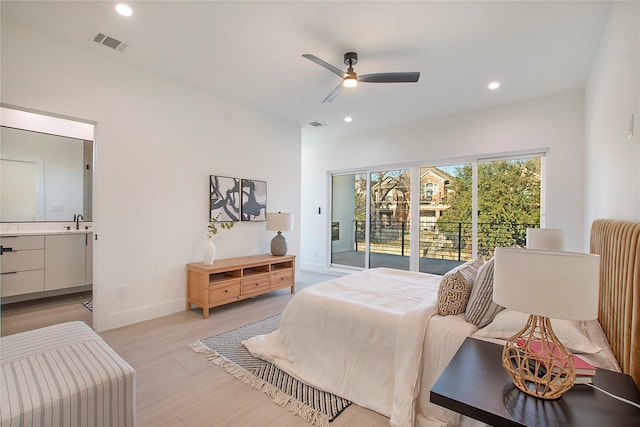 bedroom featuring light wood-type flooring, access to outside, ceiling fan, sink, and connected bathroom