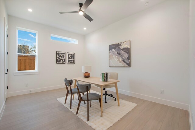 office area with ceiling fan and light hardwood / wood-style floors