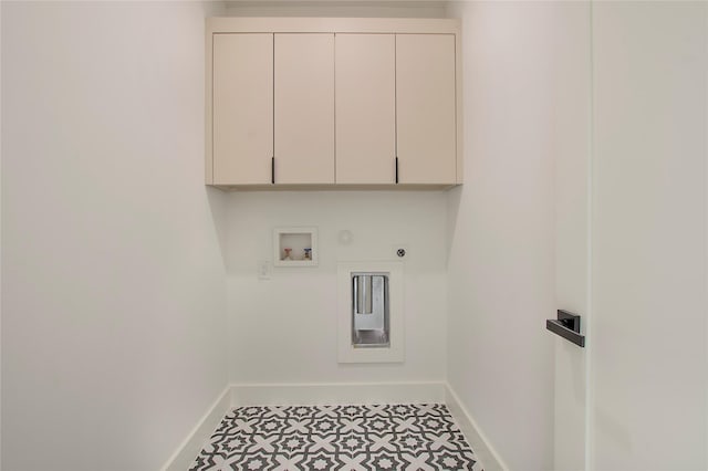 laundry room featuring cabinets, washer hookup, hookup for an electric dryer, gas dryer hookup, and tile patterned flooring