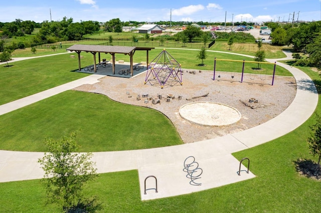 view of community featuring a gazebo, a playground, and a yard