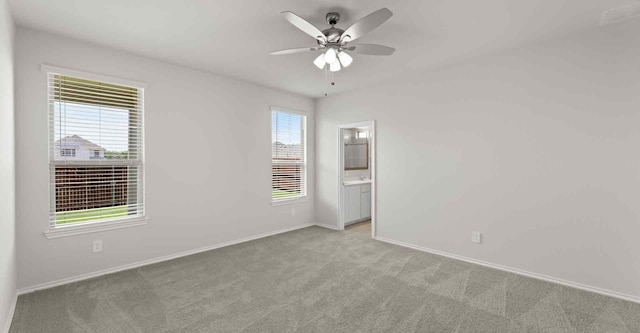 carpeted empty room with ceiling fan