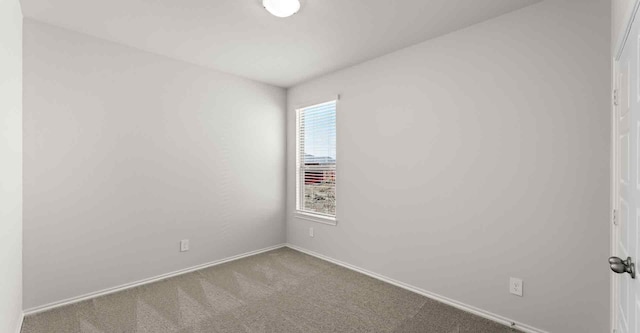 unfurnished room featuring carpet flooring