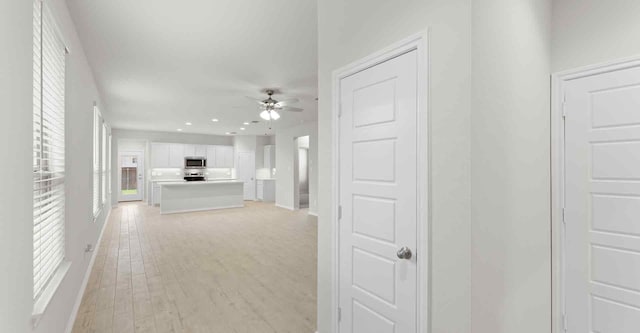 corridor featuring light hardwood / wood-style flooring