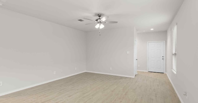 unfurnished room with ceiling fan and light wood-type flooring