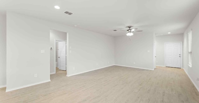 unfurnished room with light hardwood / wood-style flooring and ceiling fan