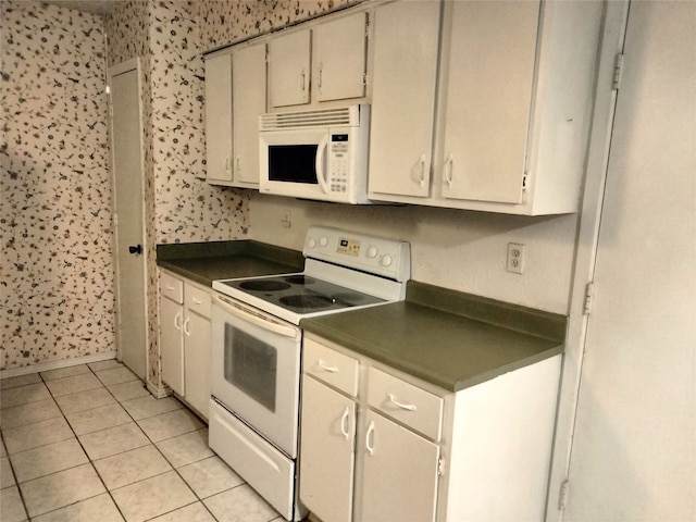 kitchen featuring white appliances and light tile patterned floors