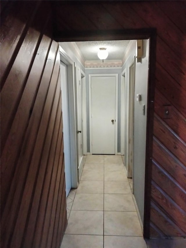 hallway with light tile patterned floors