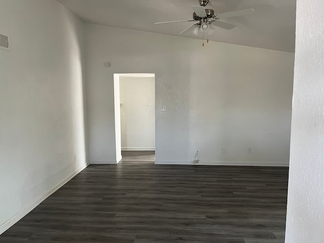 empty room featuring ceiling fan, dark hardwood / wood-style flooring, and lofted ceiling