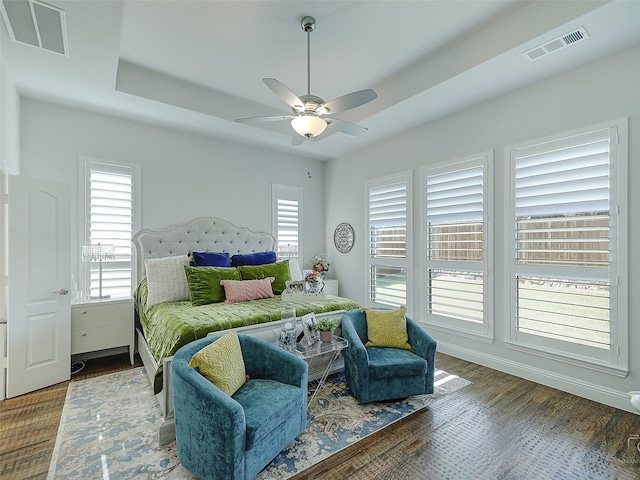 bedroom with ceiling fan and dark wood-type flooring