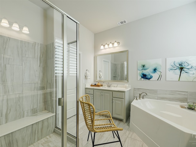 bathroom featuring separate shower and tub, tile patterned floors, and vanity