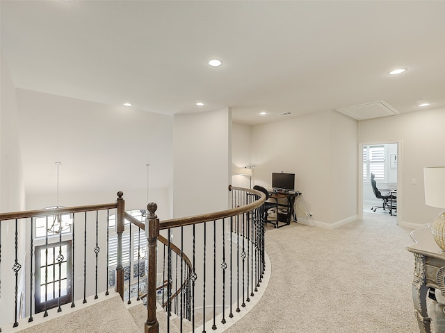 hallway with light carpet