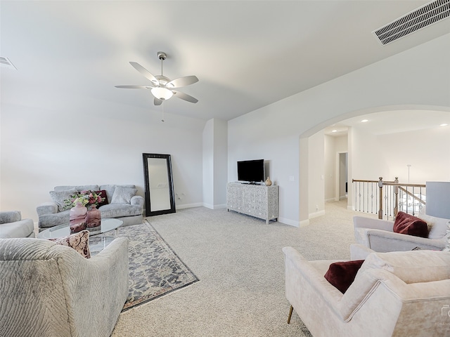 living room featuring light carpet and ceiling fan