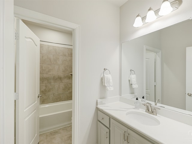 bathroom with vanity and tiled shower / bath combo