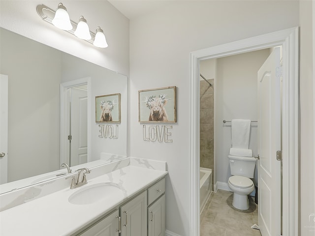 full bathroom featuring tile patterned floors, vanity, tiled shower / bath combo, and toilet