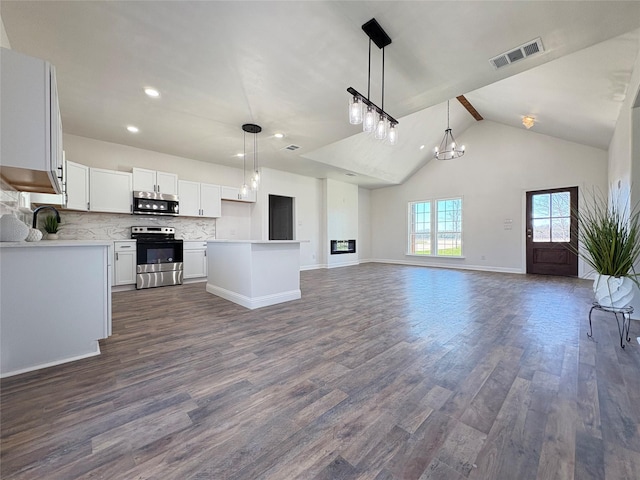 kitchen with dark wood-style floors, visible vents, appliances with stainless steel finishes, and open floor plan