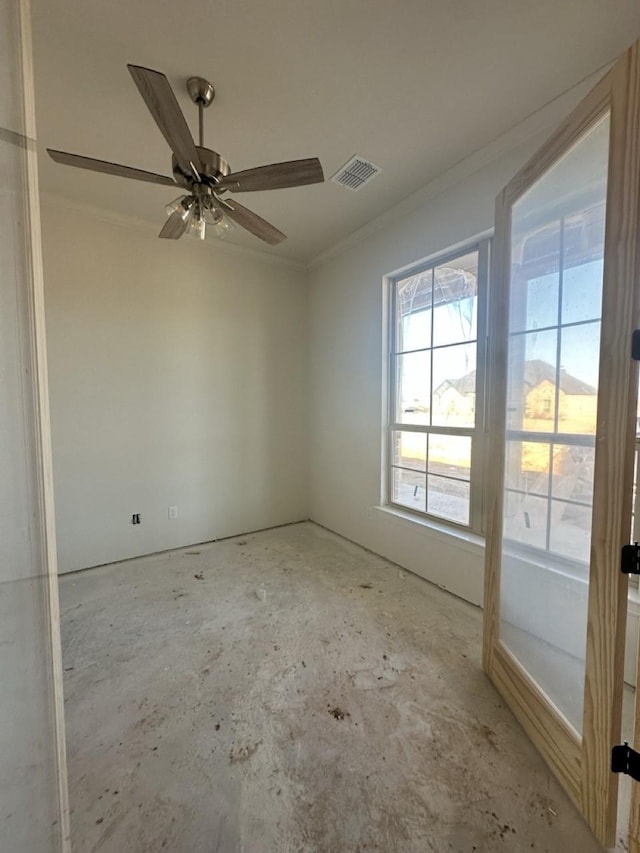 spare room with ceiling fan and crown molding