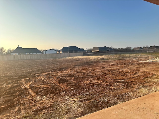 view of yard at dusk