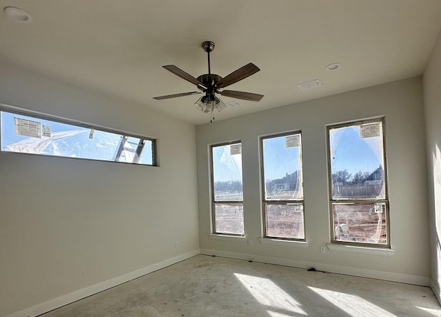 spare room with ceiling fan