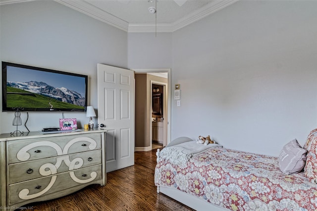 bedroom with crown molding and dark wood-type flooring