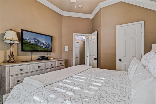 bedroom with vaulted ceiling and ornamental molding