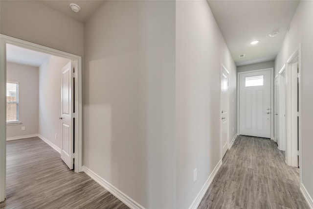 hall with light hardwood / wood-style floors