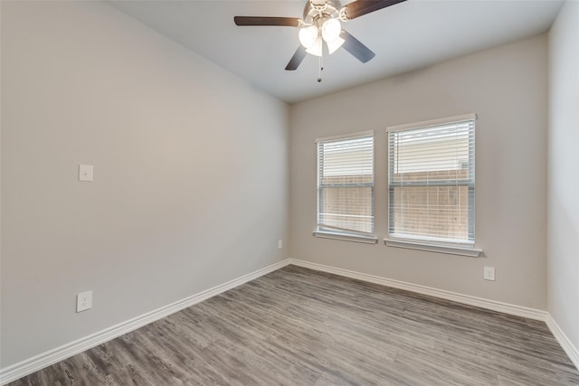 unfurnished room featuring ceiling fan and light wood-type flooring