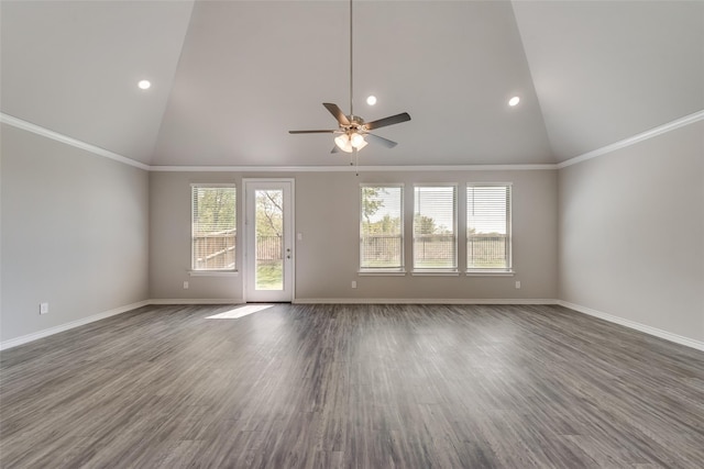 unfurnished living room featuring dark hardwood / wood-style floors, ceiling fan, ornamental molding, and vaulted ceiling