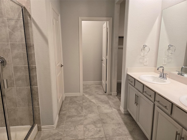 bathroom with vanity and an enclosed shower