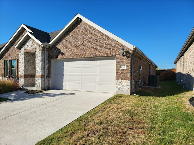 view of side of home featuring a lawn, central AC unit, and a garage