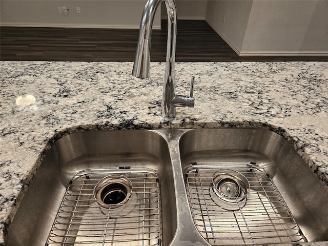 details featuring sink and stone countertops