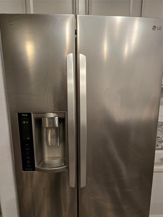 interior details with stainless steel fridge