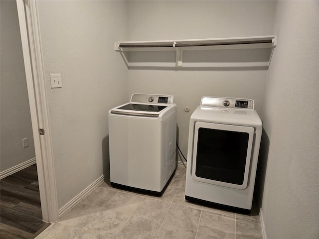 laundry area with washing machine and dryer