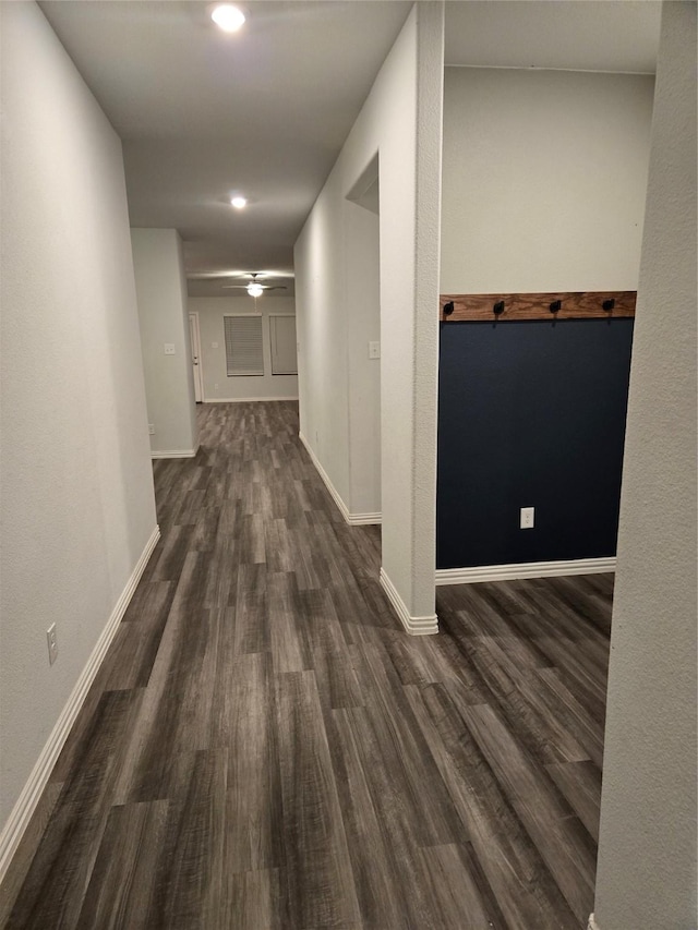 hallway with dark hardwood / wood-style floors