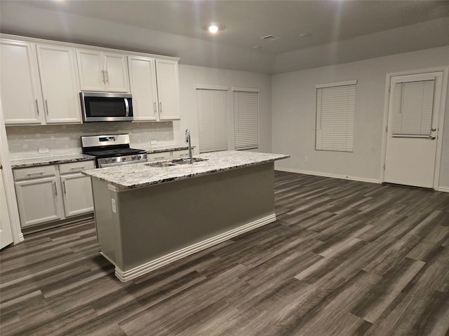 kitchen featuring white cabinetry, an island with sink, stainless steel appliances, and sink