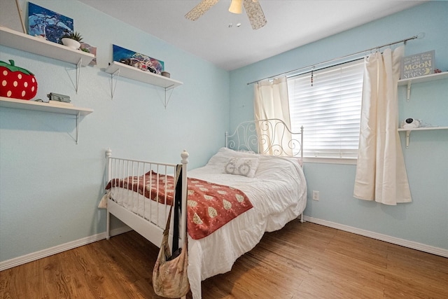 bedroom featuring hardwood / wood-style flooring and ceiling fan