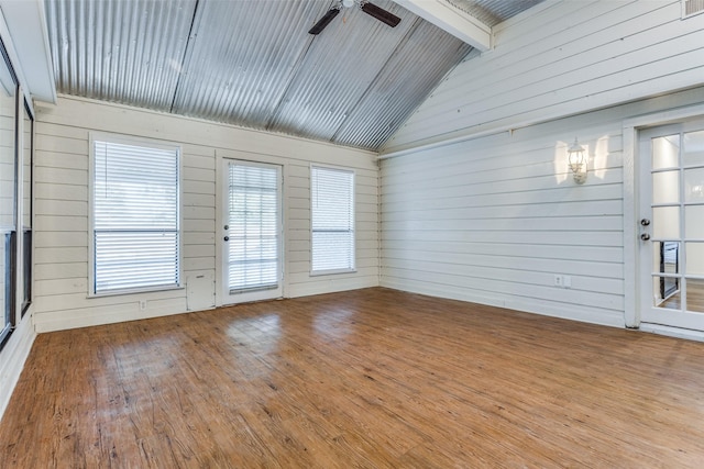 unfurnished sunroom with vaulted ceiling with beams, ceiling fan, and wood ceiling