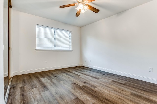 spare room featuring hardwood / wood-style flooring and ceiling fan