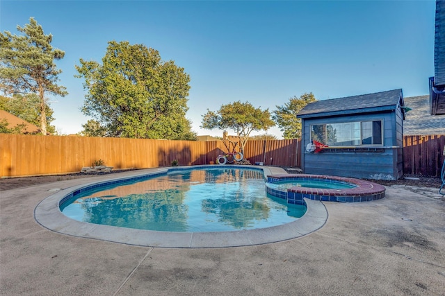 view of swimming pool featuring an in ground hot tub