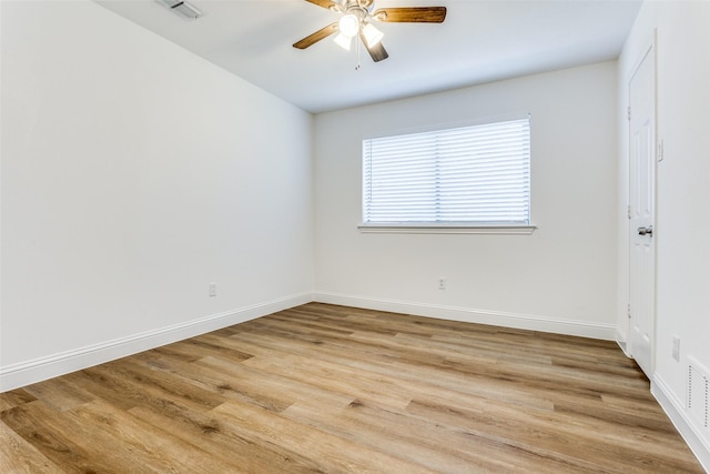 unfurnished room with hardwood / wood-style floors and ceiling fan