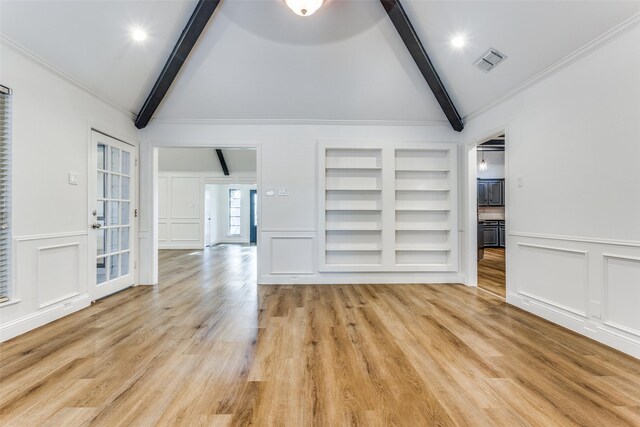 unfurnished living room featuring vaulted ceiling with beams, light wood-type flooring, and ornamental molding