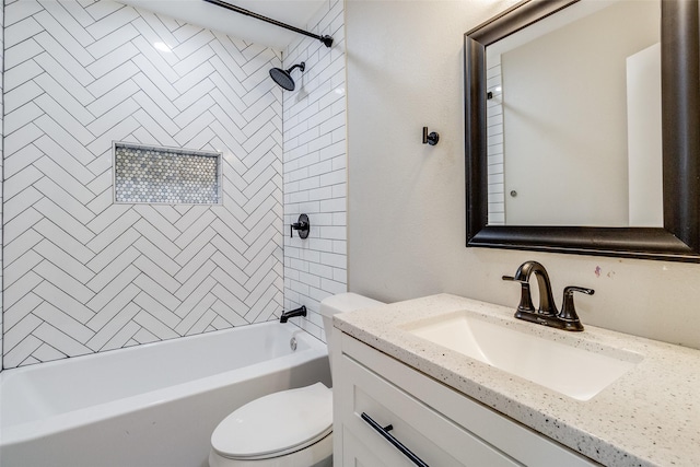 full bathroom featuring vanity, toilet, and tiled shower / bath