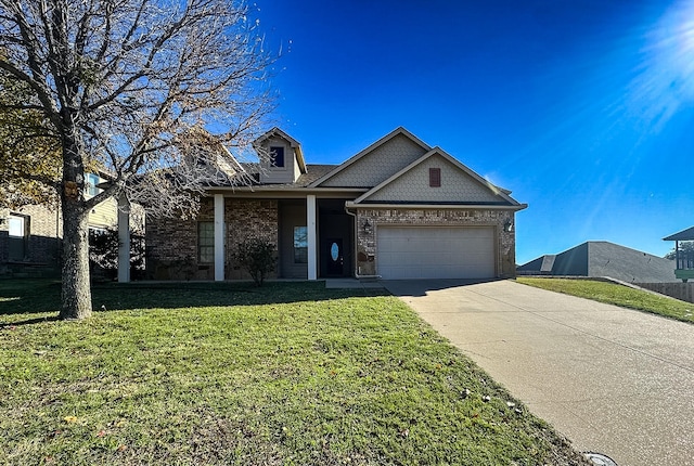 view of front of property with a garage and a front lawn