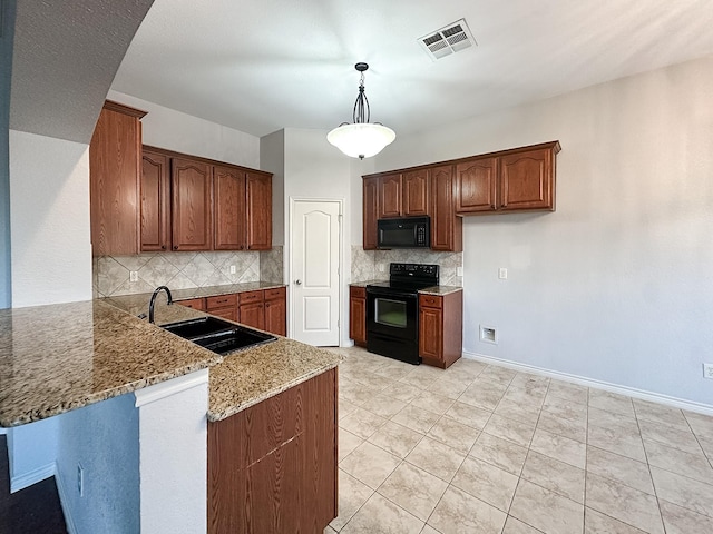 kitchen with backsplash, light stone counters, sink, black appliances, and pendant lighting