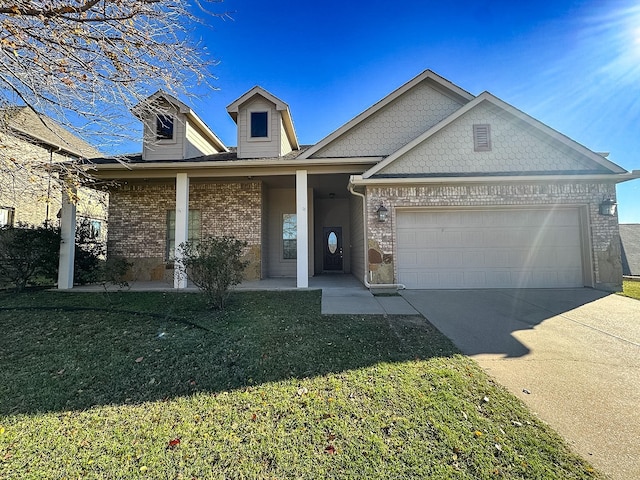 view of front of home with a garage and a front lawn