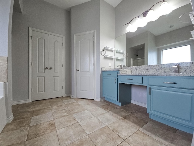bathroom with vanity and walk in shower