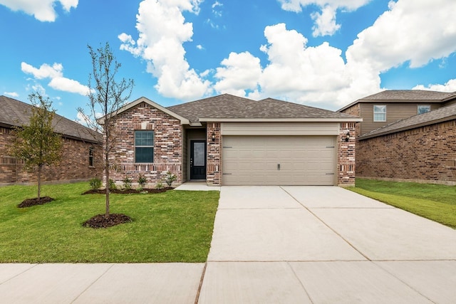 view of front of house featuring a garage and a front lawn