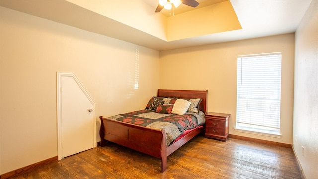 bedroom with ceiling fan and dark hardwood / wood-style flooring